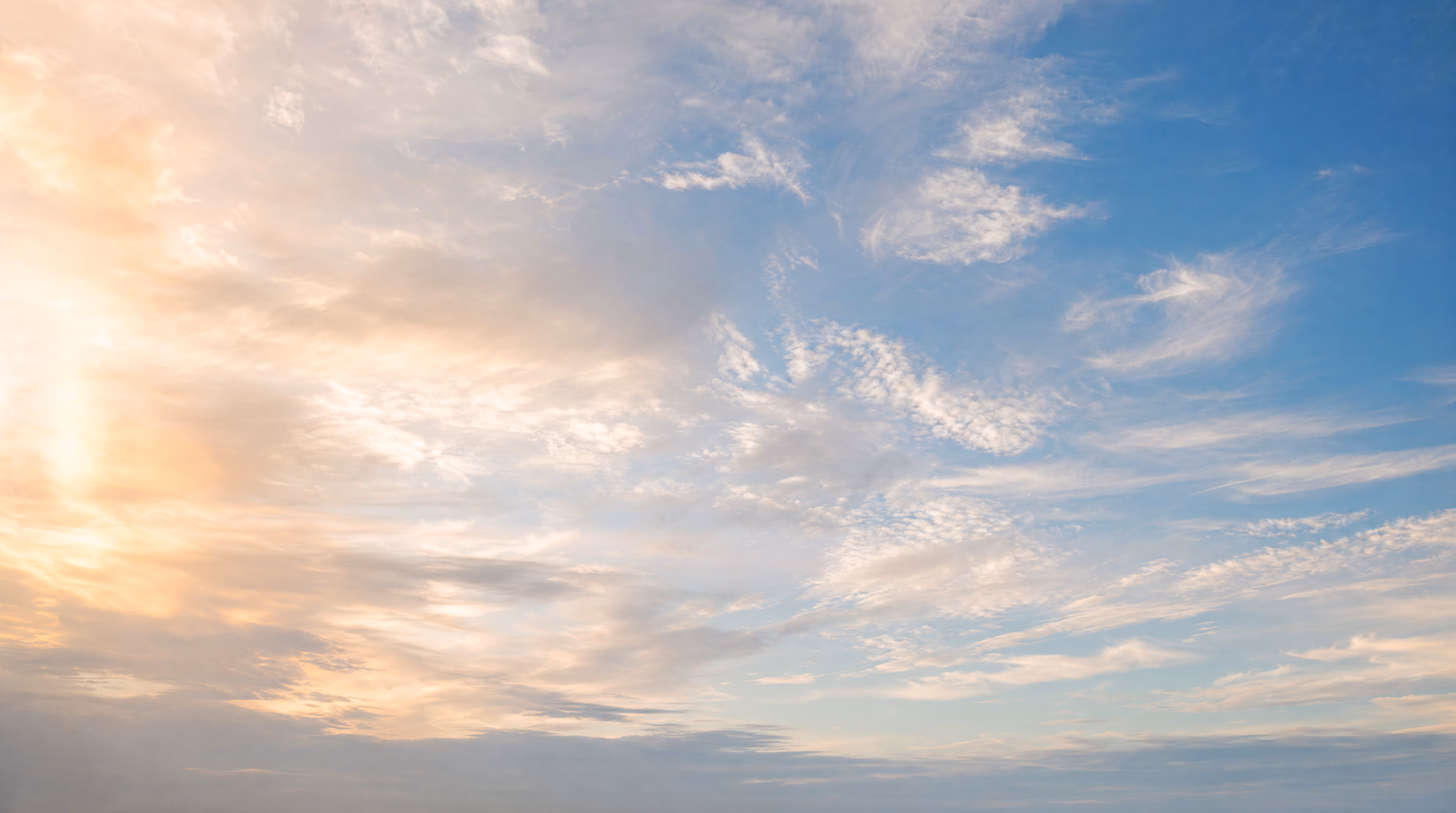 Vast open sky with soft layered clouds